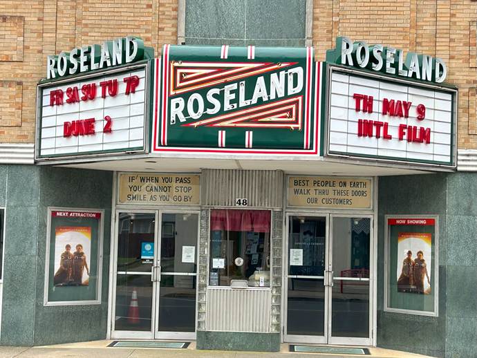 A front view of a movie theater

AI-generated content may be incorrect.
